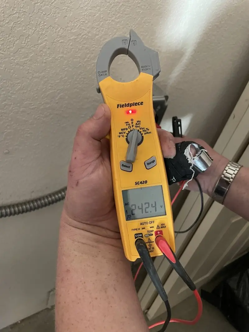Voltage testing with clamp meter during Generator Installation in Wagoner